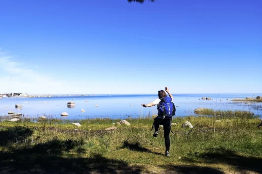 Hiker reaching the Baltic Sea coastline on Prangli Island Estonia