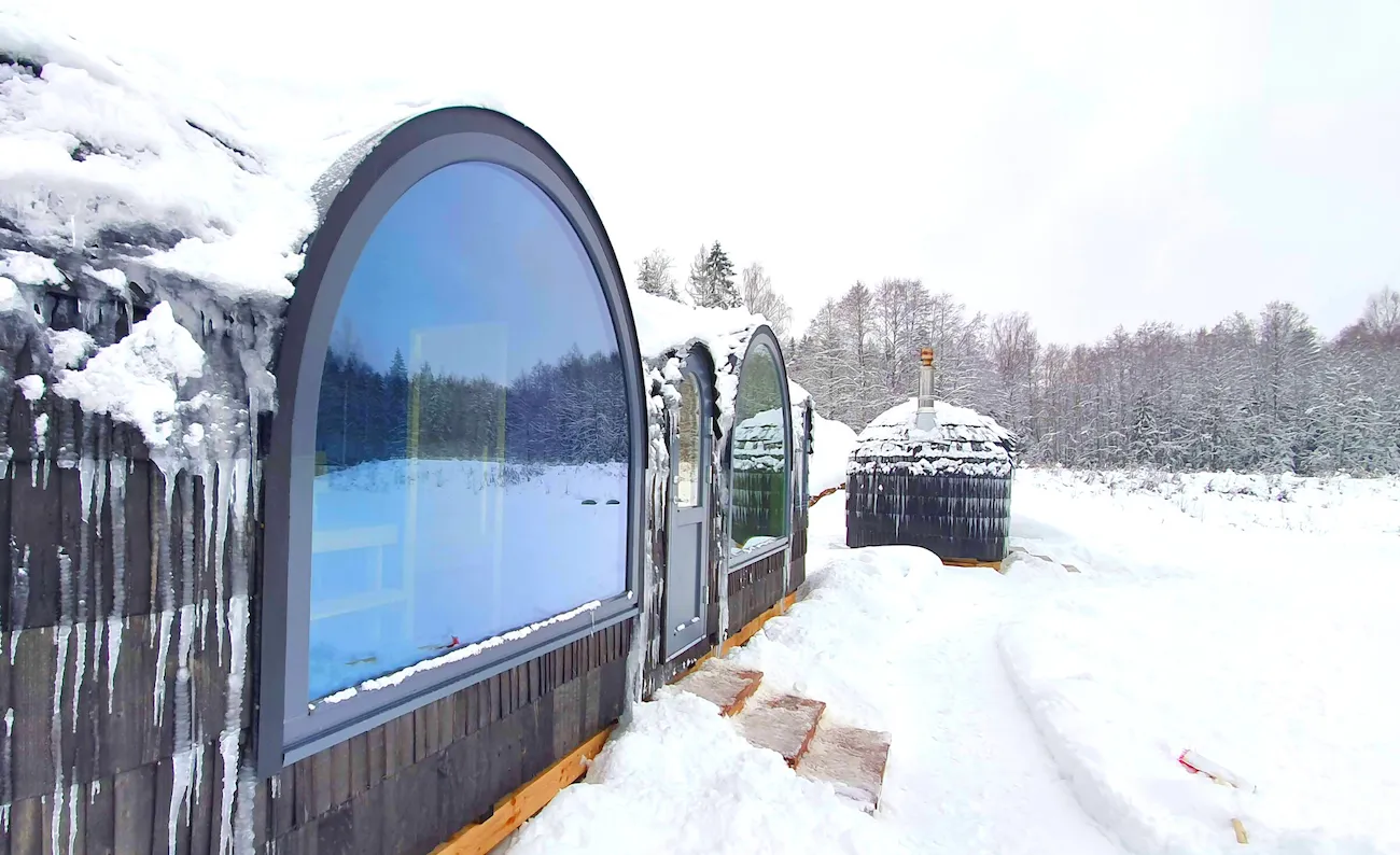 Iglu sauna in Kõrvemaa surrounded by snowy forest, winter sauna experience in Estonia