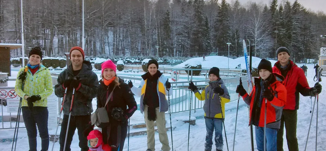 Family and children learning cross-country skiing in Tallinn