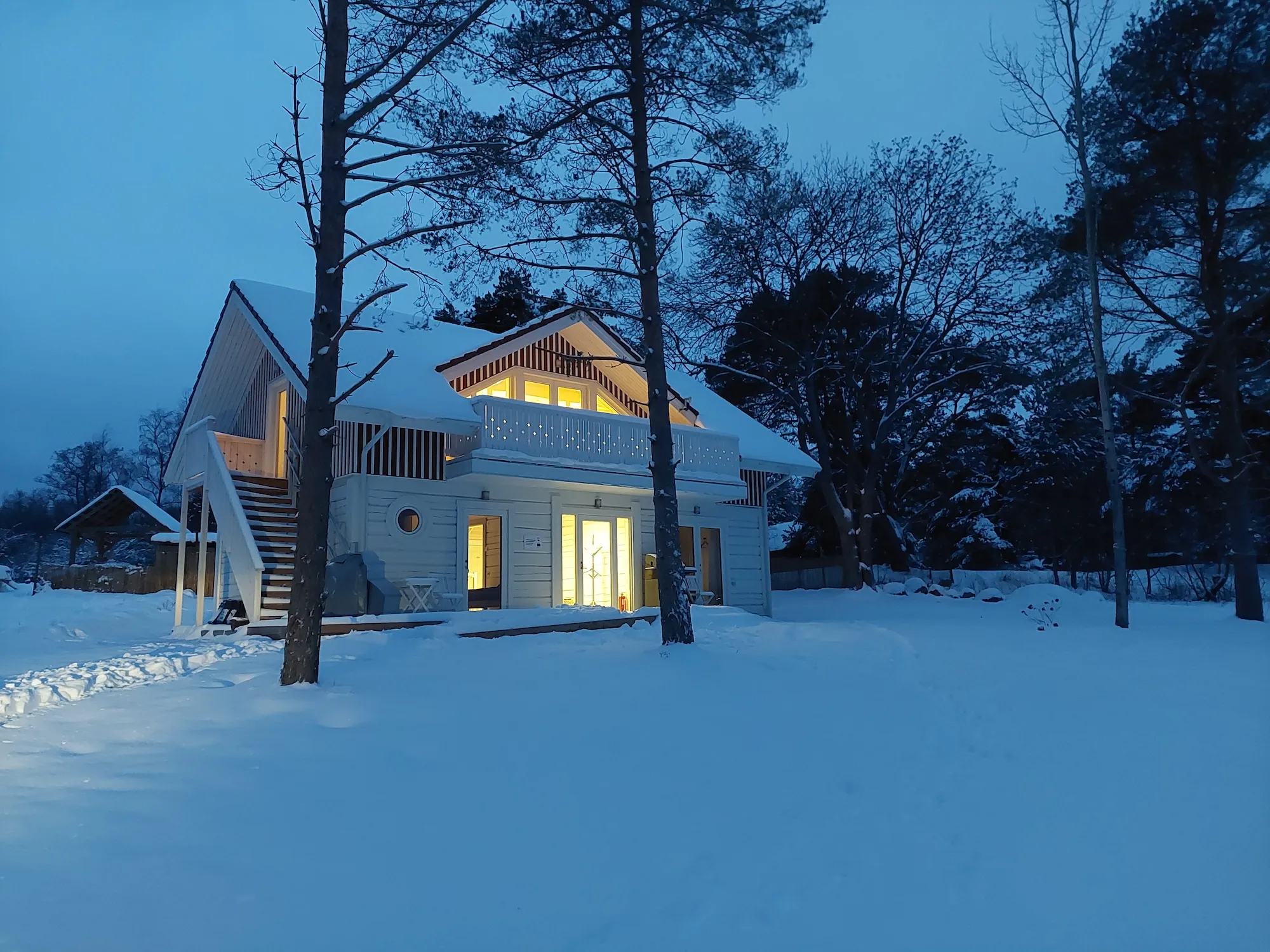 Villa of Nature Energy in winter on Prangli Island – cozy eco accommodation surrounded by snow and pine trees.
