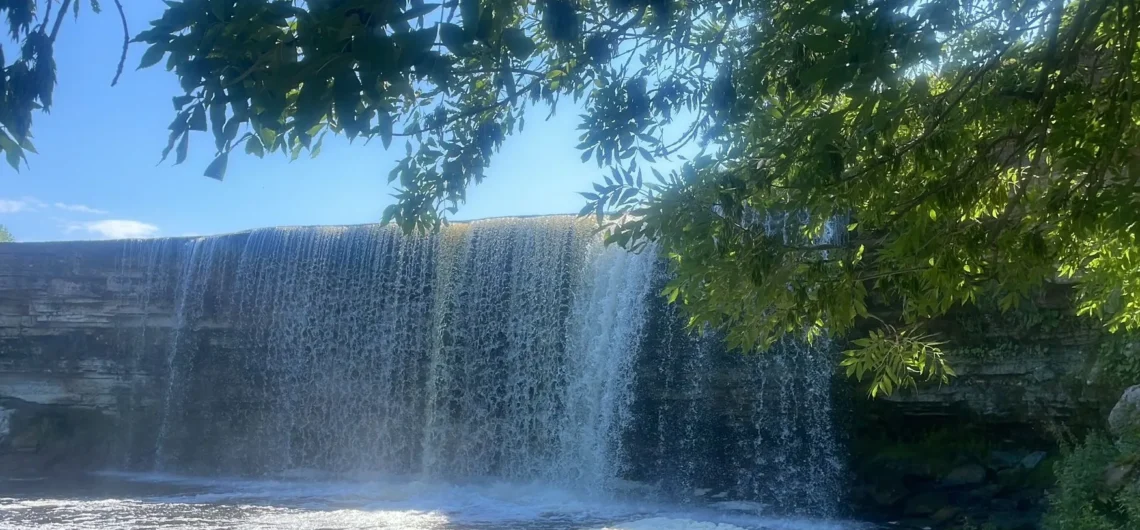 Jägala Waterfall in summer surrounded by greenery