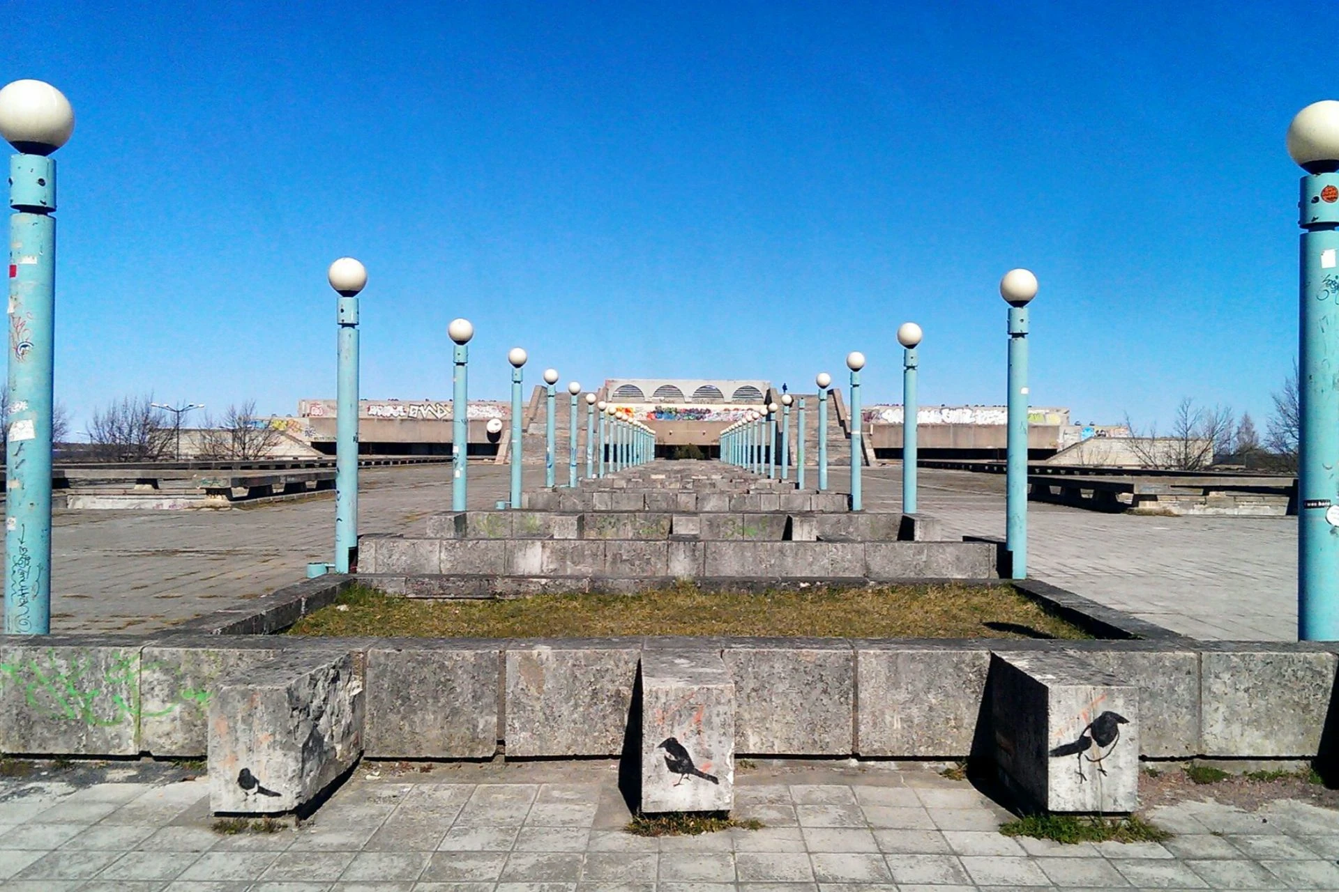 Linnahall in Tallinn, a brutalist Soviet-era concrete venue with symmetrical light columns and wide stone steps