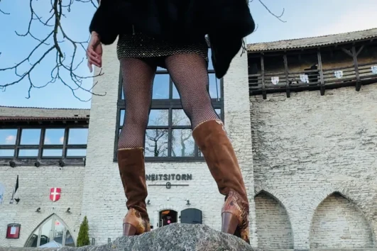 Medieval prostitution story scene near Neitsitorn in Tallinn Old Town during the Scandalous Medieval Tallinn Old Town Tour