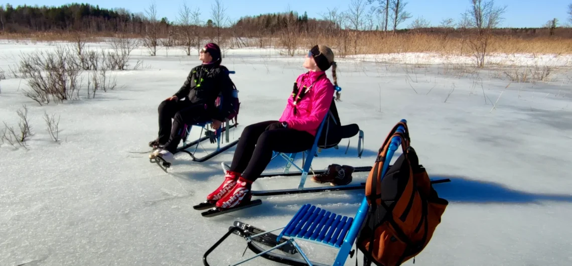 Outdoor ice skating on a frozen bog lake in Estonia with a guided winter tour