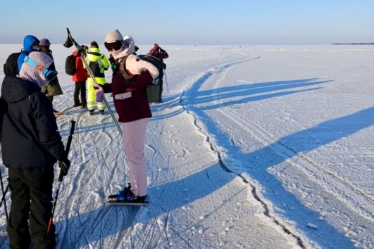 Ice skating on natural ice on the frozen Baltic Sea in Estonia during a guided winter tour