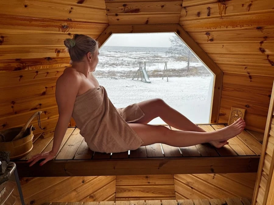 Private sauna with panoramic window at Villa of Nature Energy Prangli Island with winter sea view