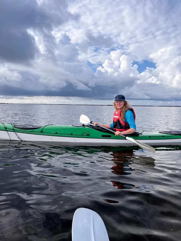 Epp, nature tour guide at Prangli Travel, kayaking on calm water in Estonia