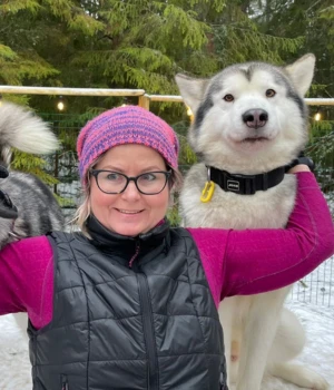 Marilin, tour guide at Prangli Travel, outdoors in Estonia with a dog