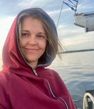 Nele, travel consultant at Prangli Travel, on a boat on the water along the Estonian north coast