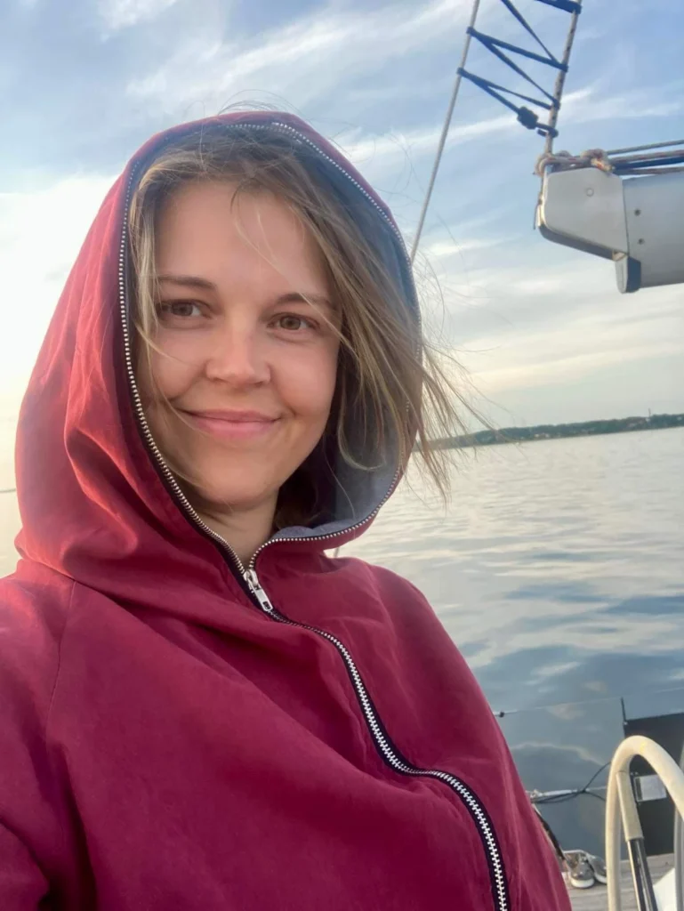Nele, travel consultant at Prangli Travel, on a boat on the water along the Estonian north coast